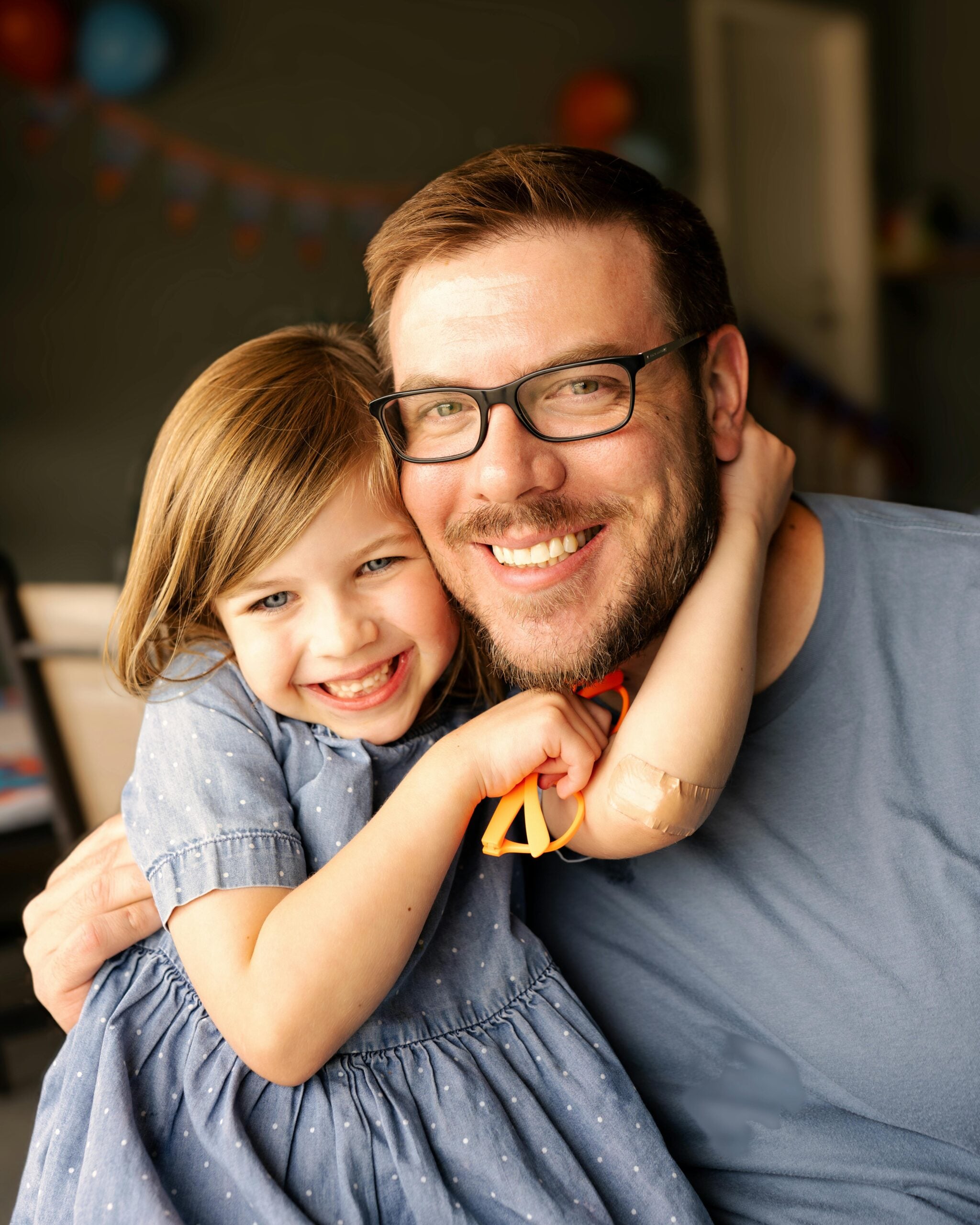 Warm portrait of a smiling father and daughter with good eye care habits